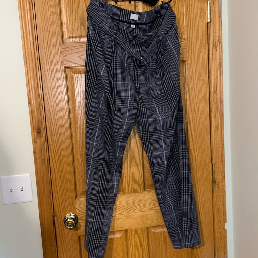 Purple plaid dress pants with belt size 12, no stains or tears.